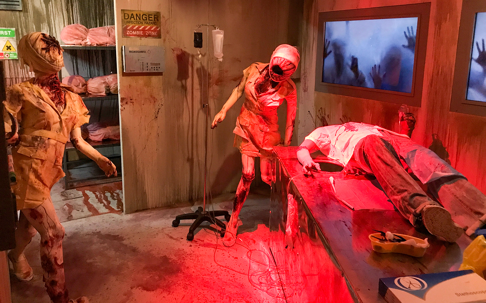 Ghost Museum Penang zombie-themed exhibit with eerie figures and dim lighting.