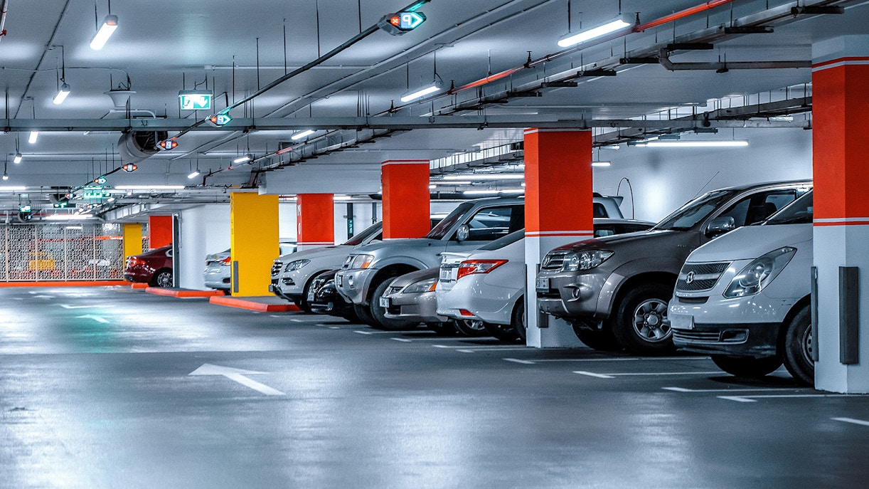 Underground parking area at Piazzale Roma, Venice with parked cars.
