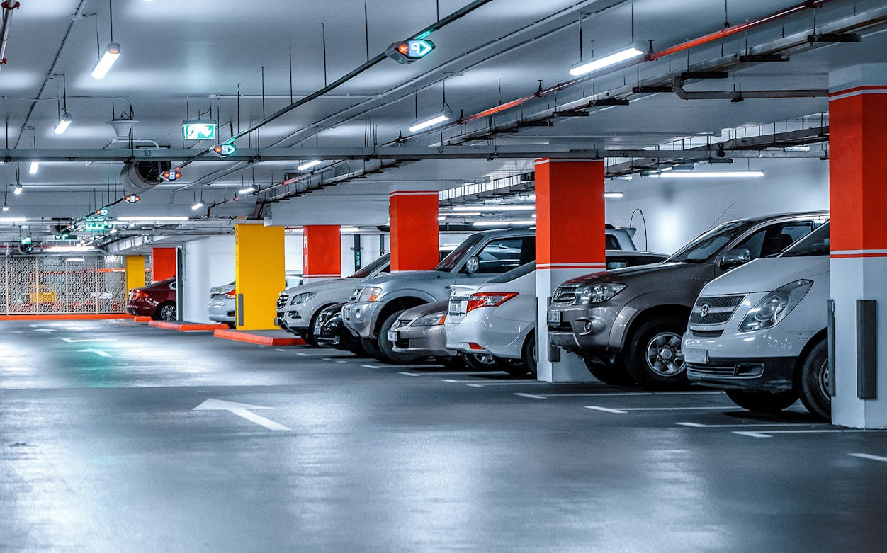 Underground parking area at Piazzale Roma, Venice with parked cars.