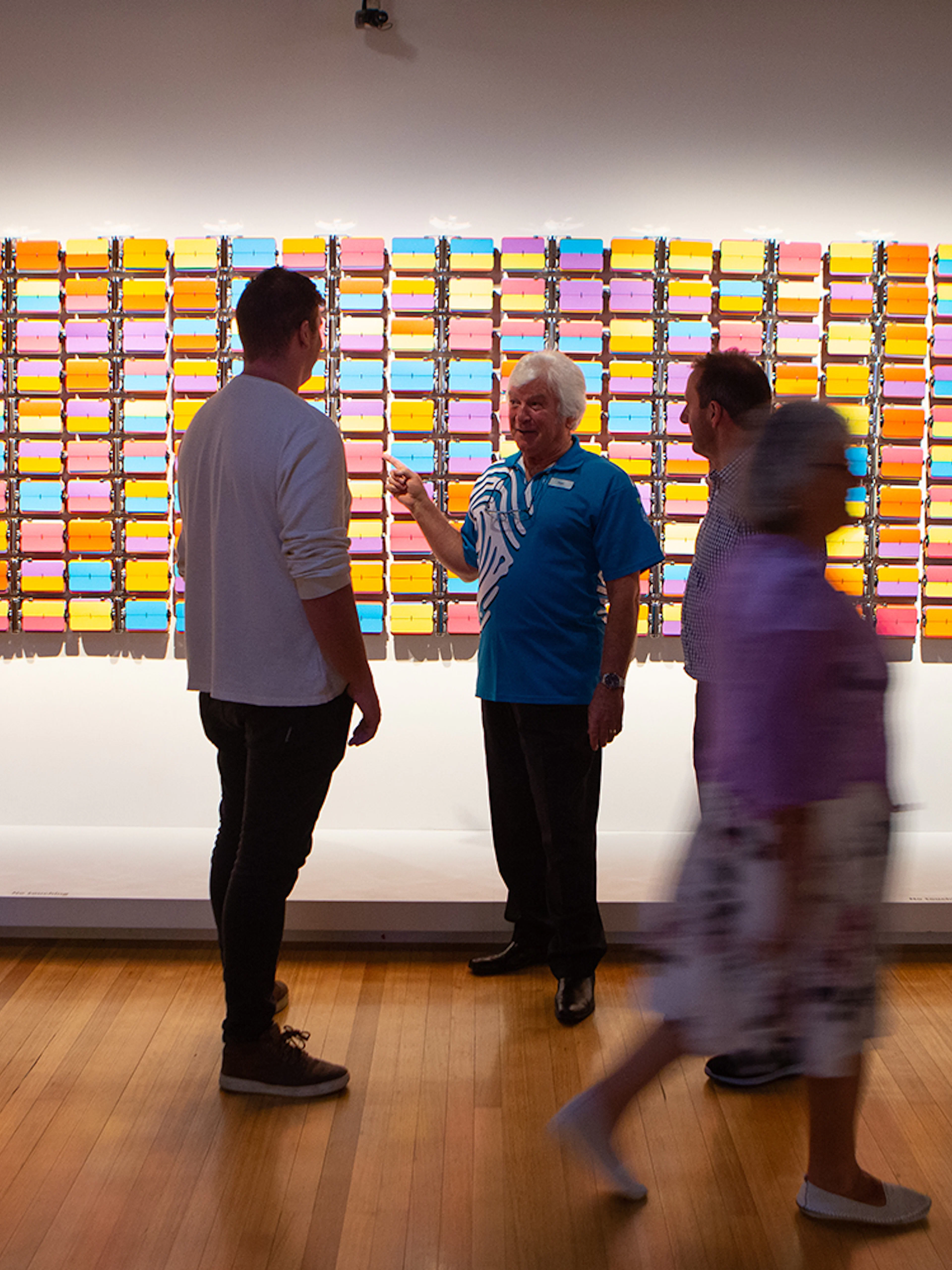 Visitors viewing colorful art installation at Museum of New Zealand Te Papa Tongarewa.