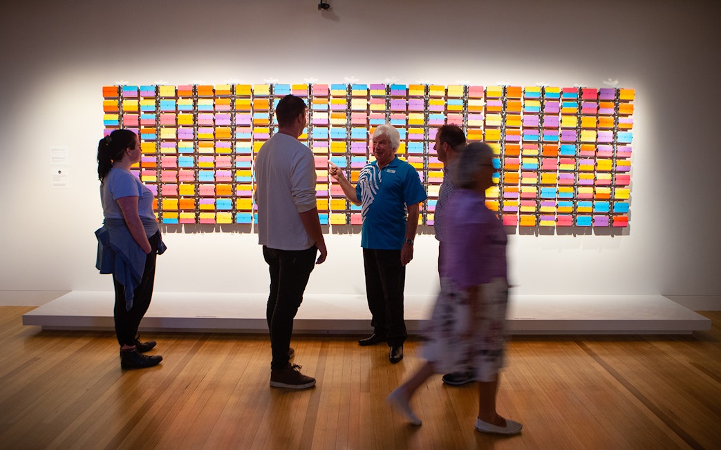 Visitors viewing colorful art installation at Museum of New Zealand Te Papa Tongarewa.