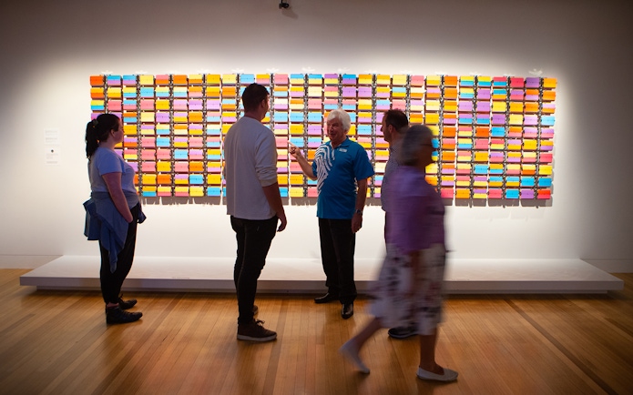 Visitors viewing colorful art installation at Museum of New Zealand Te Papa Tongarewa.