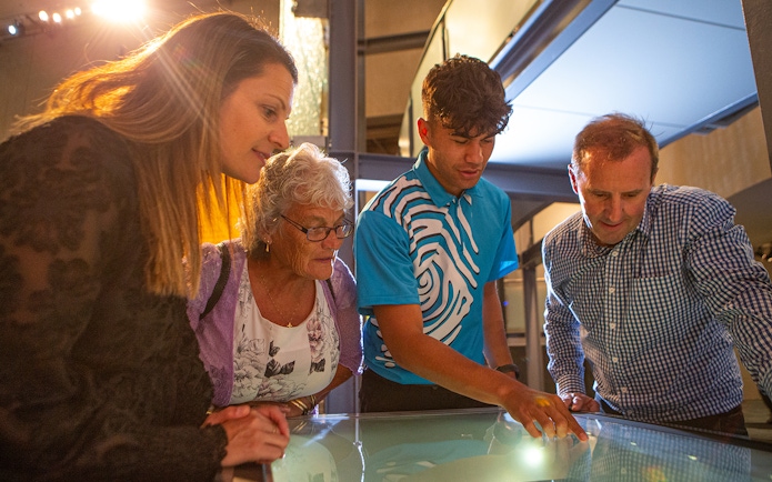 Visitors engaging with an interactive exhibit at Museum of New Zealand Te Papa Tongarewa.