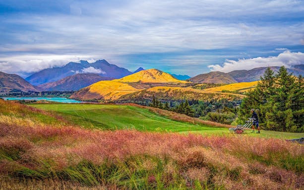 Scenic view of mountains and Lake Tekapo on Queenstown to Christchurch tour.