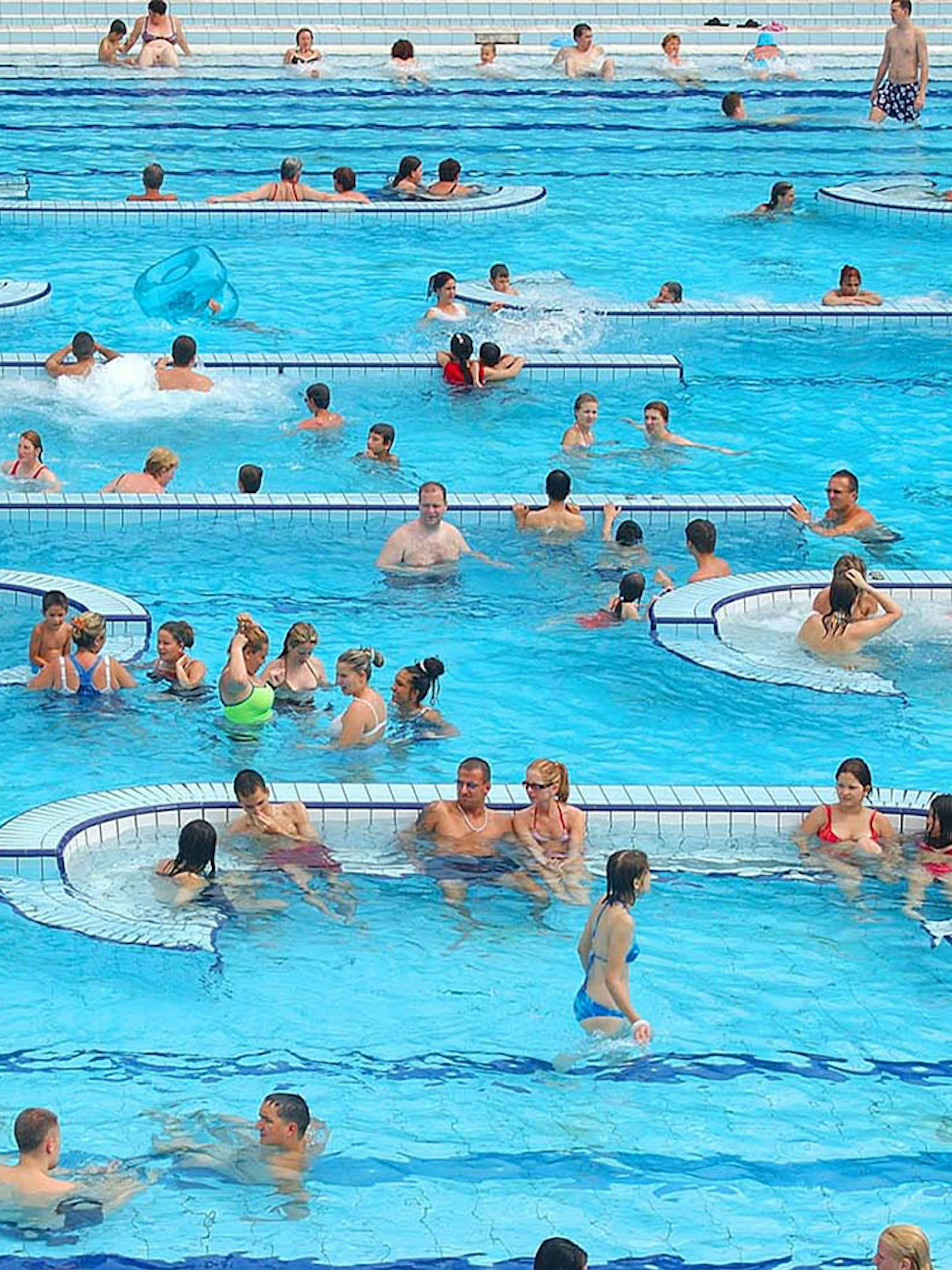 Visitors enjoying the pools at Palatinus Spa, Budapest.