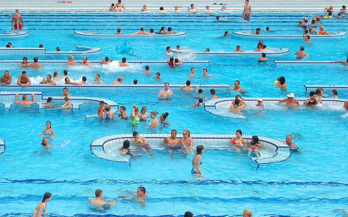 Visitors enjoying the pools at Palatinus Spa, Budapest.