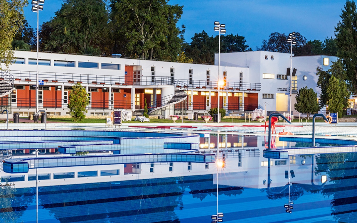 Palatinus Spa outdoor pool area in Budapest at dusk.