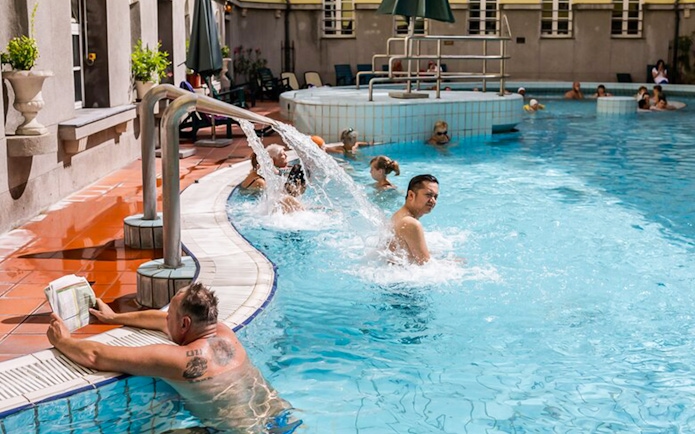 Visitors enjoying thermal pools at Lukacs Baths, Budapest.