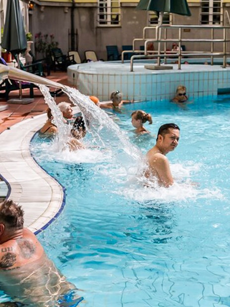 Visitors enjoying thermal pools at Lukacs Baths, Budapest.