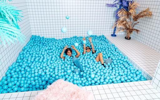 Visitors enjoying a ball pit at Studio of Wonders.