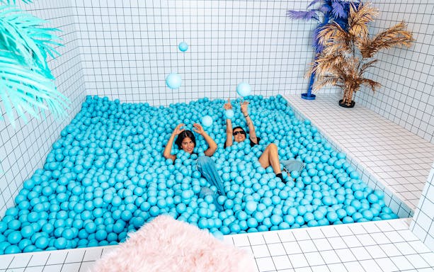 Visitors enjoying a ball pit at Studio of Wonders.