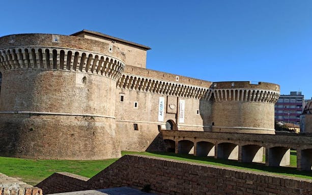 Senigallia night tour with guide, exploring historic streets and ending with a drink.