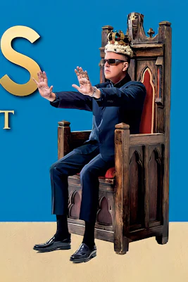 Suggs sitting on a throne with text "What A King Cnut – A Life in The Realm Of Madness.