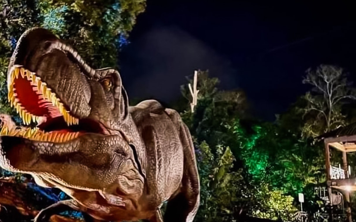 Dinosaur exhibit at Zoo Melaka at night.
