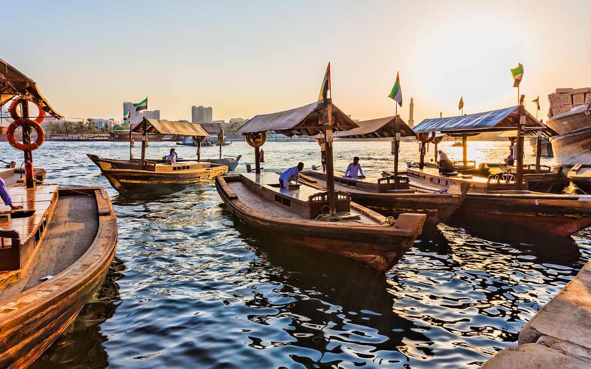Abra boats on Dubai Creek at sunset during Snapshot Tour of Dubai.