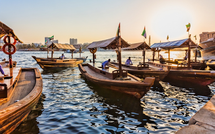 Abra boats on Dubai Creek at sunset during Snapshot Tour of Dubai.