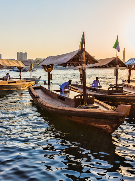 Abra boats on Dubai Creek at sunset during Snapshot Tour of Dubai.