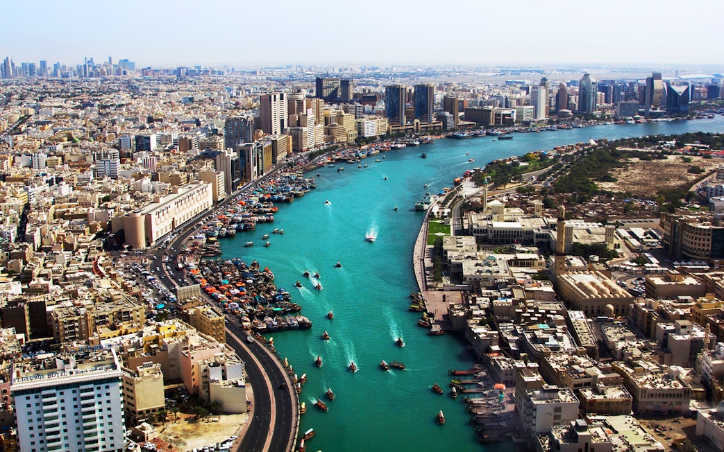 Dubai Creek with boats and city skyline, part of Snapshot Tour of Dubai.