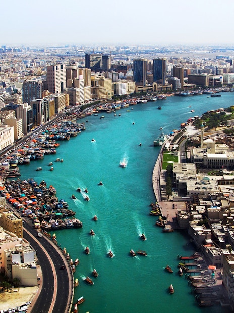 Dubai Creek with boats and city skyline, part of Snapshot Tour of Dubai.