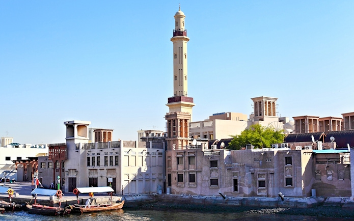 Historic Al Fahidi District with wind towers and minaret, Dubai.
