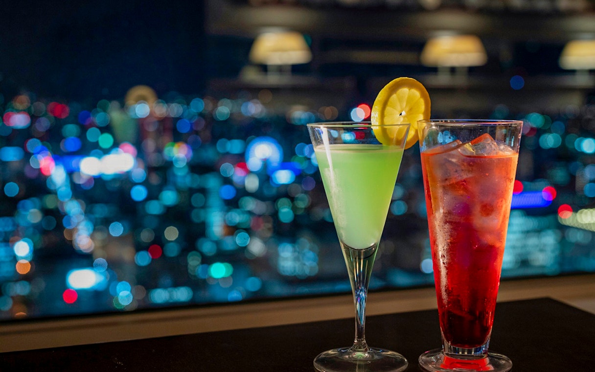 Cocktails with city lights view from JR Tower Observation Deck T38 in Sapporo.