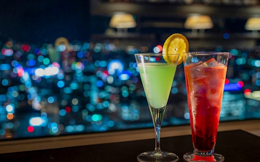 Cocktails with city lights view from JR Tower Observation Deck T38 in Sapporo.