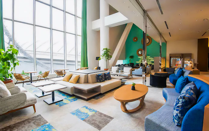 Spa LaQua lounge area with modern seating and large windows in Tokyo.