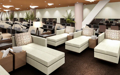 Spa LaQua relaxation lounge with reclining chairs and personal screens in Tokyo.