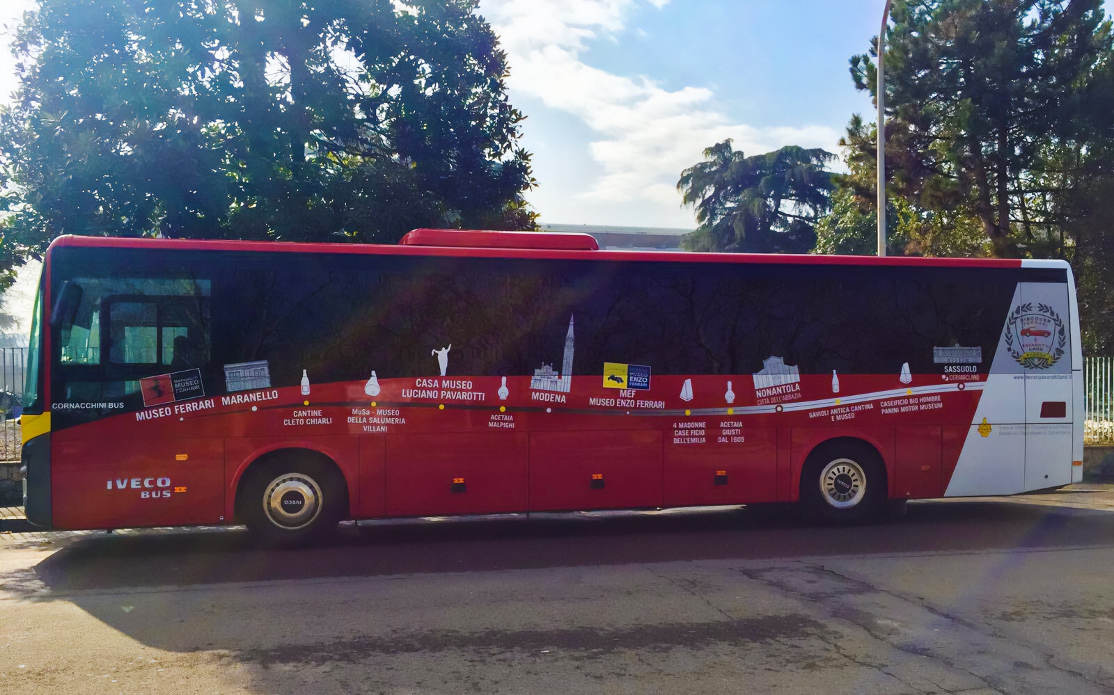 Red bus for transfers from Modena Station to Ferrari Museum Maranello and Enzo Ferrari Museum.