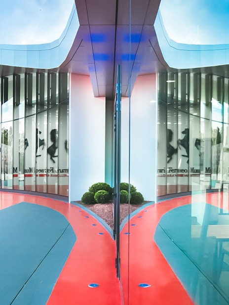 Ferrari Museum Maranello entrance with iconic prancing horse logo.