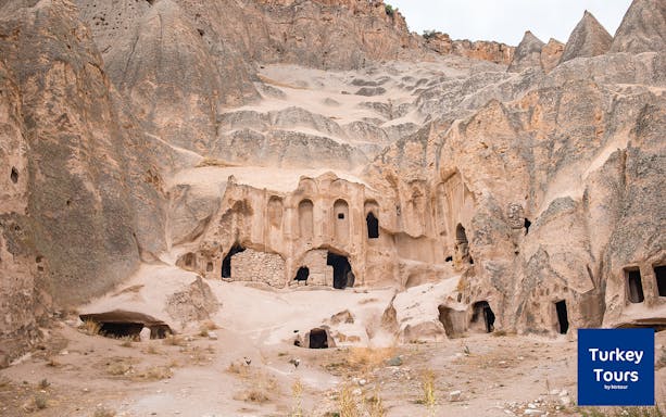 Ancient rock-cut dwellings in Cappadocia's Ilhara Valley, part of the Green Tour.