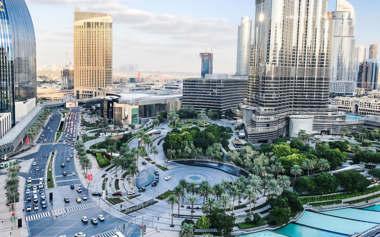 Dubai cityscape with modern skyscrapers and busy streets, part of the guided tour and monorail ride experience.