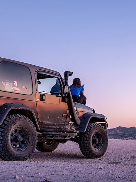 Guided off-road Jeep tour in Cappadocia at sunset with scenic views.
