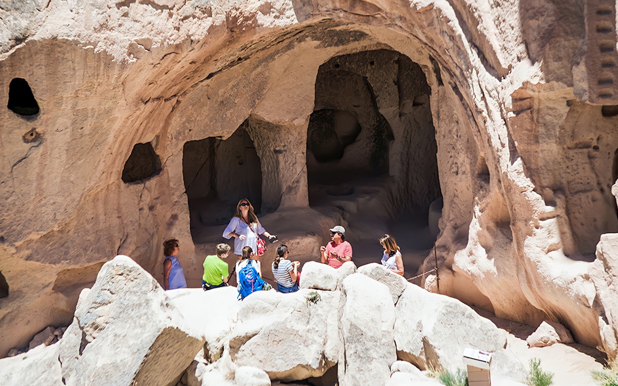 Tour group exploring cave dwellings in Cappadocia during private tour.