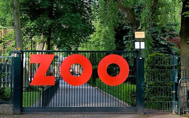 Krakow Zoo entrance gate with large red letters.