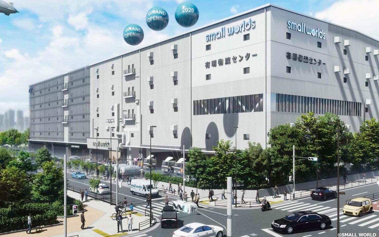 Small Worlds Tokyo building exterior with street view and pedestrians.