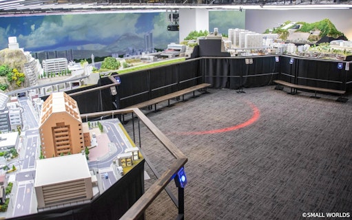 Miniature cityscape display at Small Worlds Tokyo exhibition.