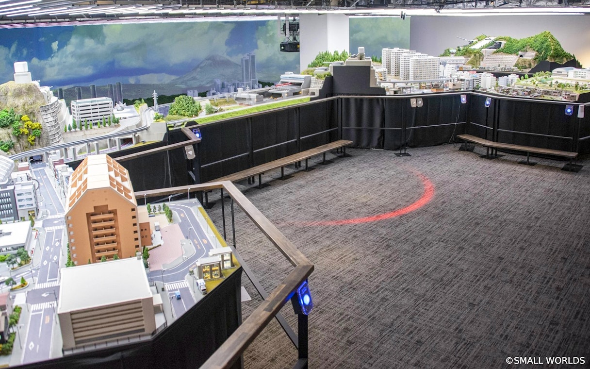 Miniature cityscape display at Small Worlds Tokyo exhibition.