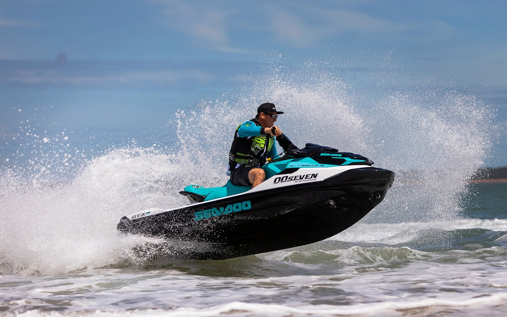 Jet ski rider navigating waves on a tour in Darwin.