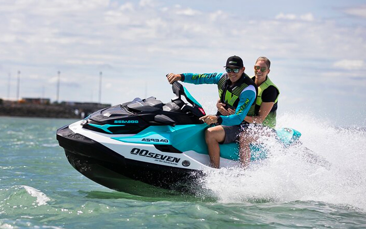 Two people riding a jet ski on a tour in Darwin, Australia.
