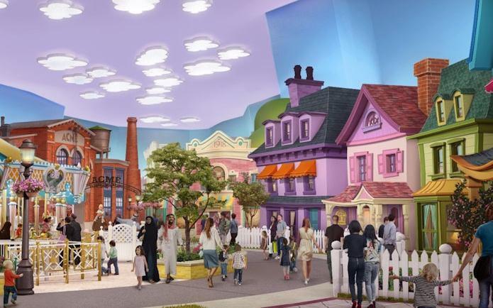 Visitors exploring cartoon-themed street at Warner Bros World Abu Dhabi.