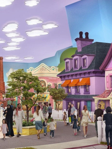 Visitors exploring cartoon-themed street at Warner Bros World Abu Dhabi.