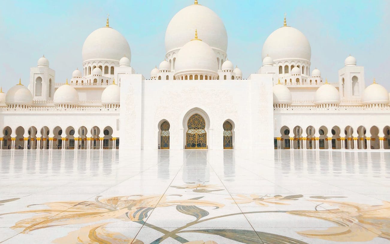 Sheikh Zayed Mosque in Abu Dhabi with intricate floral courtyard design.