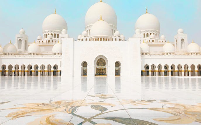 Sheikh Zayed Mosque in Abu Dhabi with intricate floral courtyard design.
