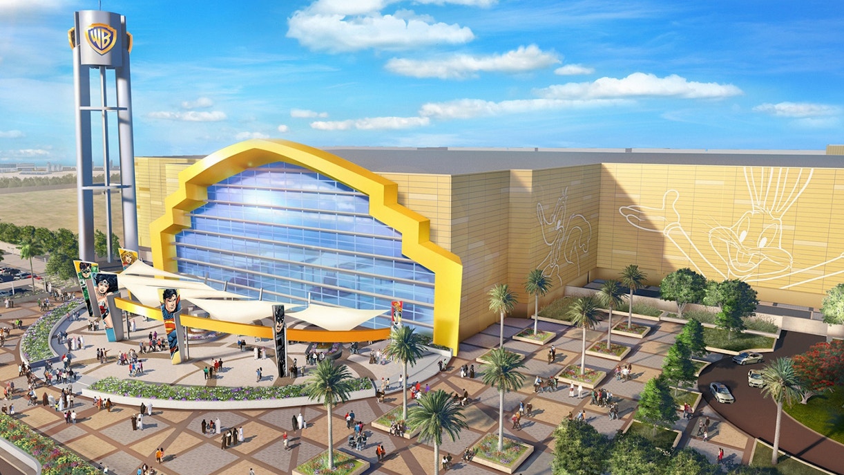 Warner Bros World Abu Dhabi entrance with iconic character statues and vibrant theme park facade.
