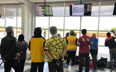 Visitors watching go-kart race results at Morac Adventure Park, Langkawi.