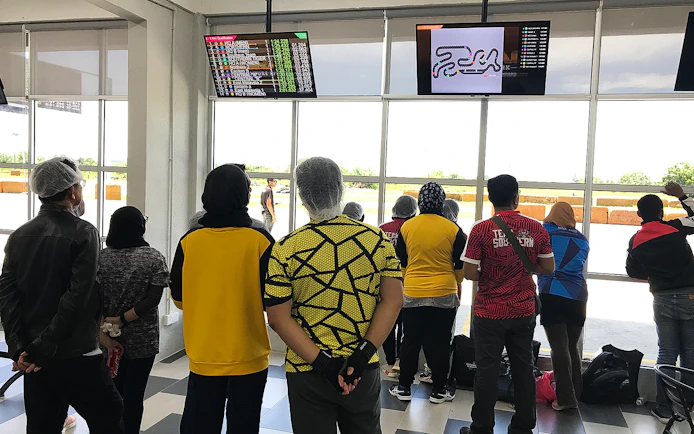 Visitors watching go-kart race results at Morac Adventure Park, Langkawi.