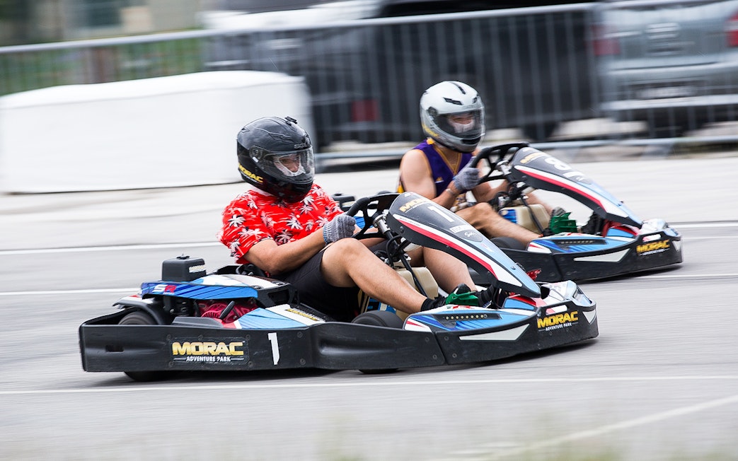 Go-kart racing at Morac Adventure Park, Langkawi, featuring two drivers on the track.