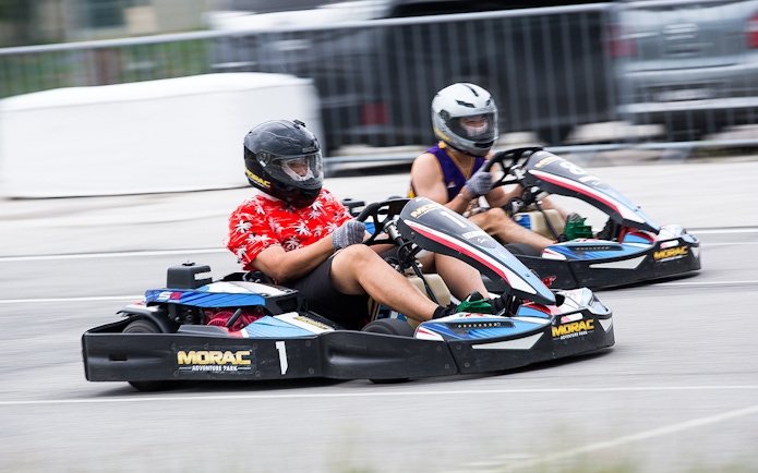 Go-kart racing at Morac Adventure Park, Langkawi, featuring two drivers on the track.