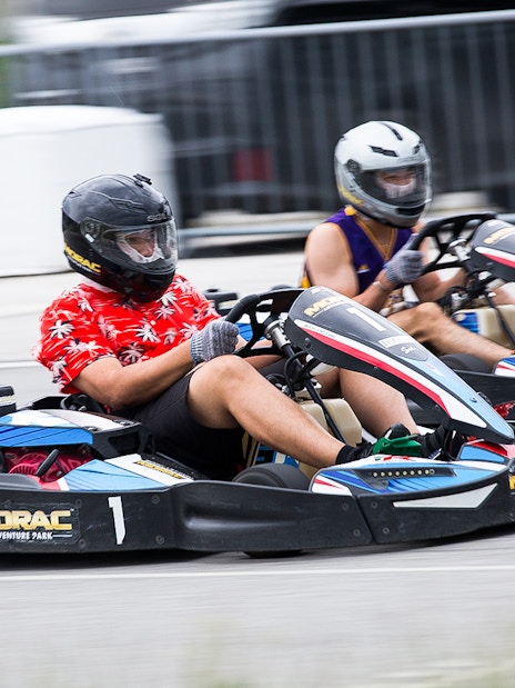 Go-kart racing at Morac Adventure Park, Langkawi, featuring two drivers on the track.